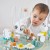 pol_pl_Janod-Wielofunkcyjny-stolik-edukacyjny-drewniany-z-regulacja-wysokosci-Ogrod-Sweet-Cocoon-12m-11855_18.jpg